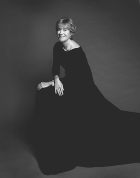 black and white photograph of a woman in a black dress by Michael Ahearn